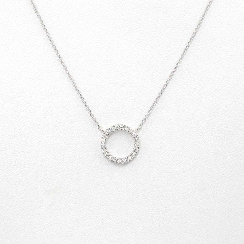 circular ring with diamond inlay and bangle chain for the collarbone